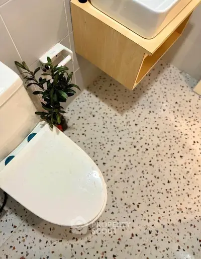 Modern bathroom with terrazzo flooring and sleek fixtures
