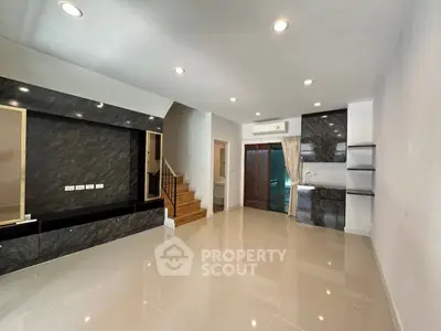 Spacious modern living room with sleek design and ample natural light