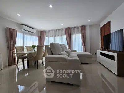 Spacious modern living room with elegant furniture and natural light