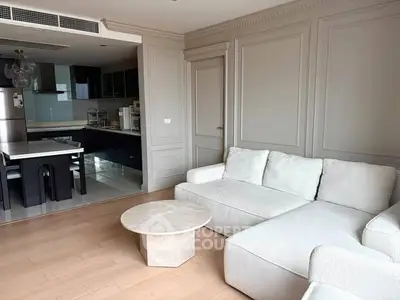 Spacious modern living room with open kitchen and elegant decor