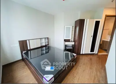 Modern bedroom with sleek wooden furniture and spacious layout