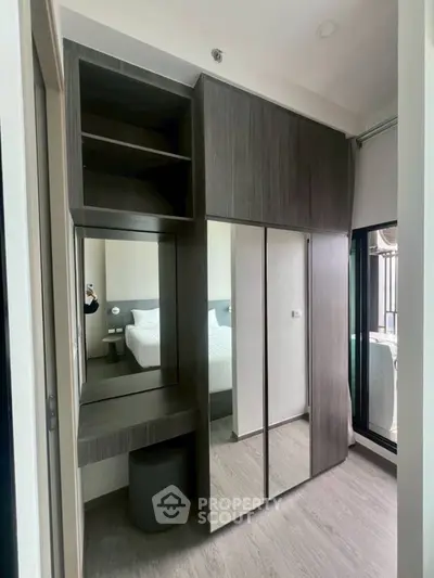 Modern bedroom with stylish built-in wardrobe and vanity area