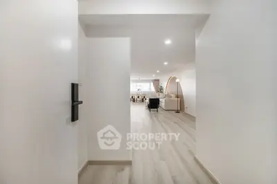 Spacious modern living room with elegant decor and open layout, perfect for entertaining.