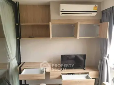 Modern living room with built-in wooden cabinets and air conditioning unit
