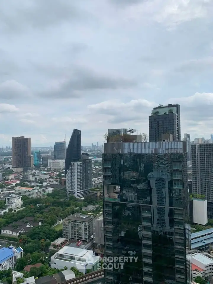 Stunning cityscape view from a high-rise building showcasing urban architecture and skyline.
