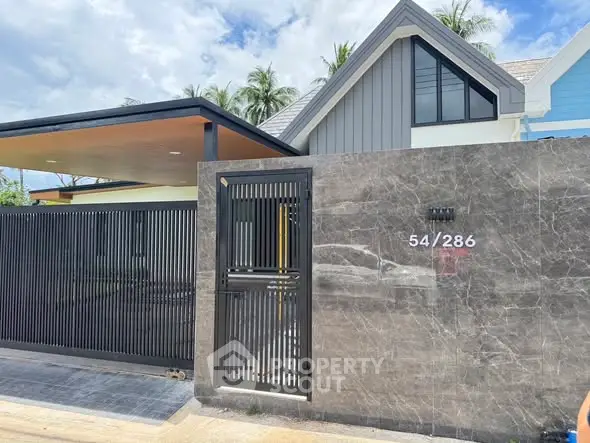Modern house exterior with sleek gate and contemporary design