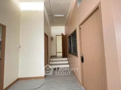 Spacious hallway with modern design and neutral tones