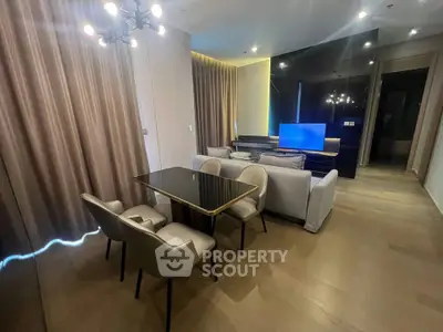 Modern living room with elegant dining area and stylish lighting