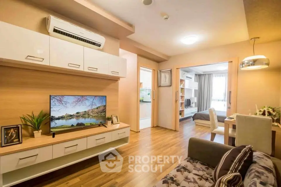 Modern living room with open layout, stylish decor, and cozy ambiance in a contemporary apartment.