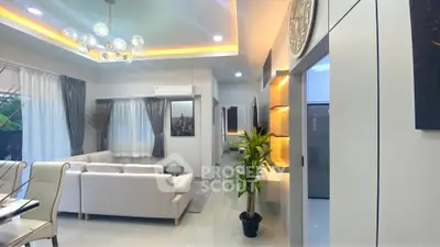 Modern living room with elegant lighting and stylish decor