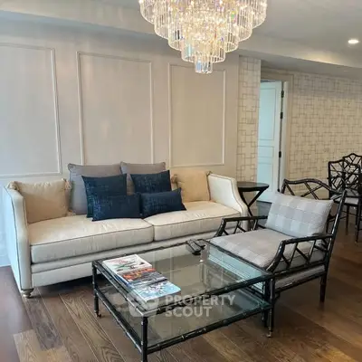 Elegant living room with chandelier and stylish furniture