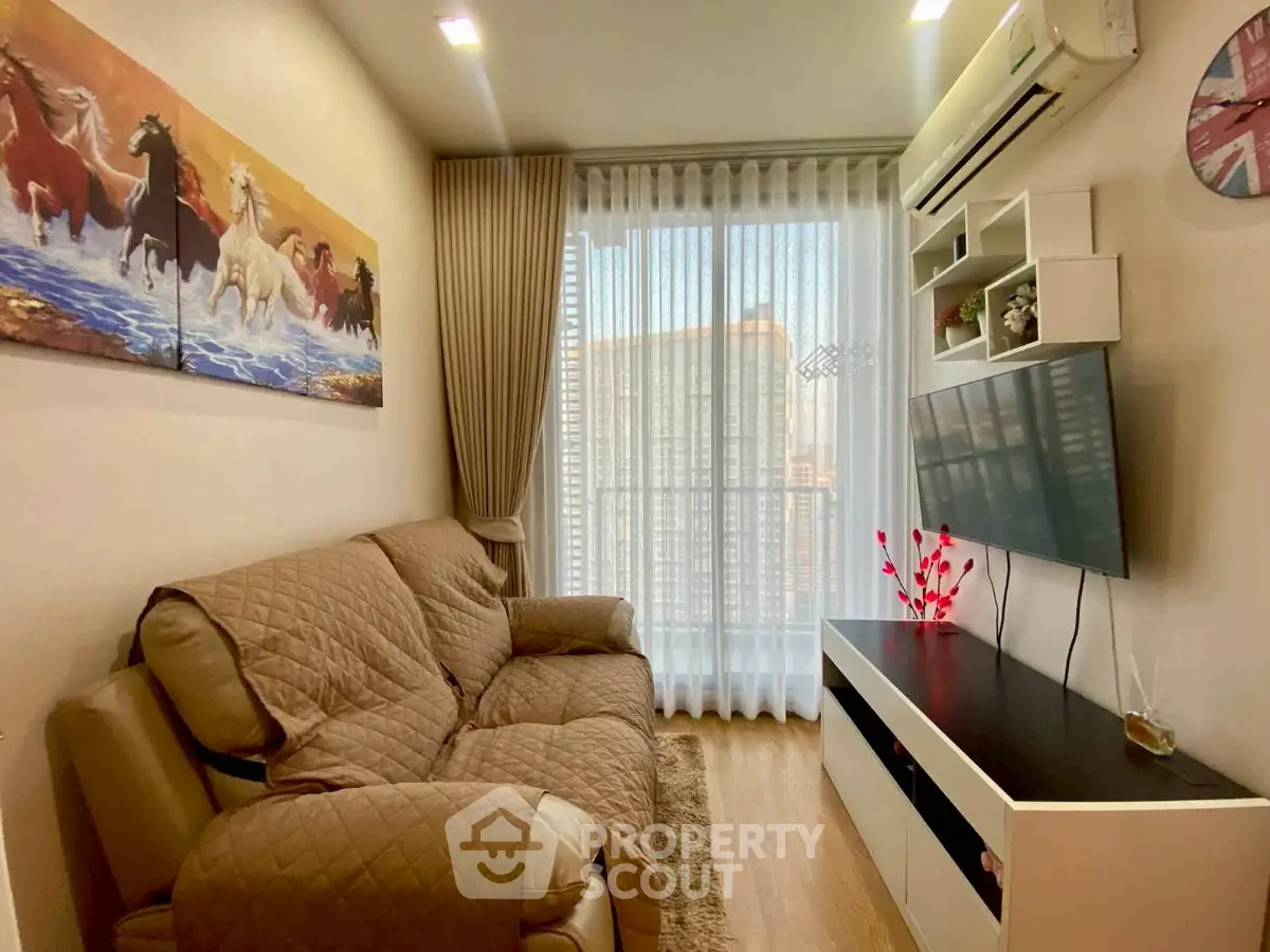 Cozy living room with modern decor and large window offering city view