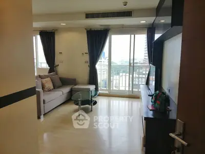 Spacious living room with modern decor and city view balcony