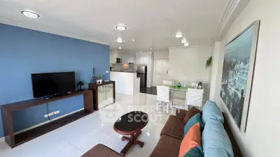 Spacious modern living room with open kitchen and stylish decor