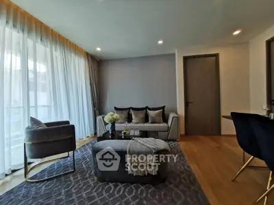 Elegant living room with modern furniture and large windows for natural light