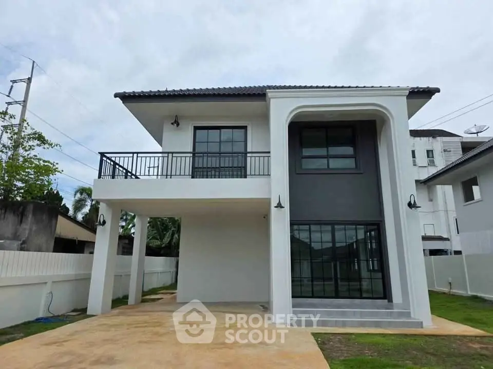 Modern two-story house with sleek design and spacious driveway