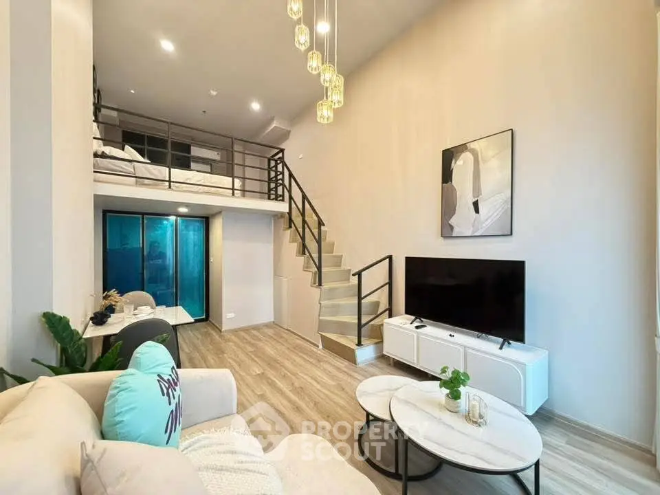 Modern loft apartment with stylish living room and mezzanine bedroom, featuring elegant decor and ample natural light.