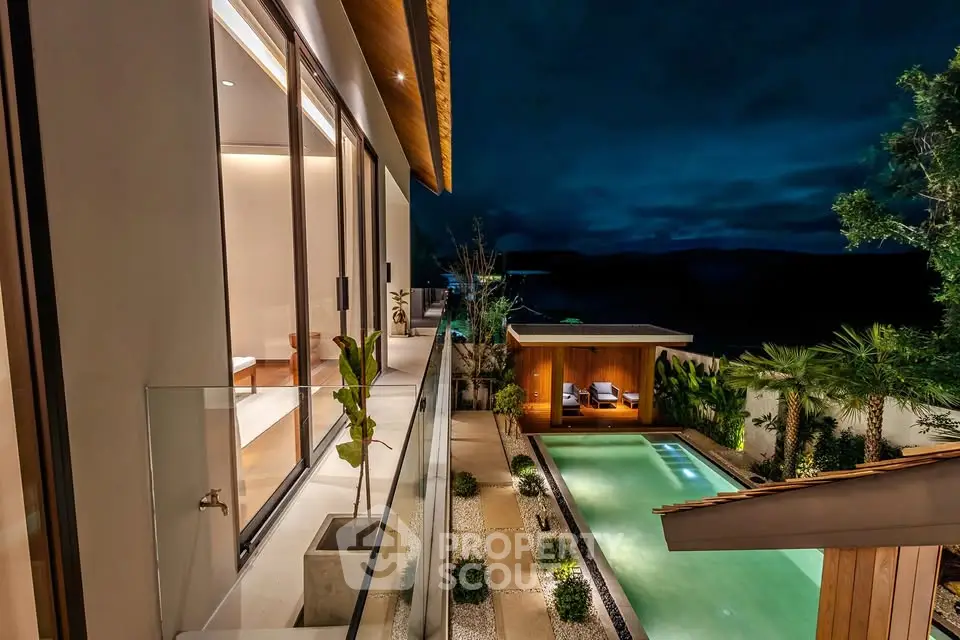 Luxurious modern home with stunning pool and lush garden at night, perfect for relaxation and entertainment.