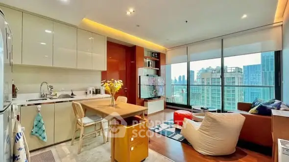 Modern open-plan living room with city view, stylish kitchen, and cozy seating area.