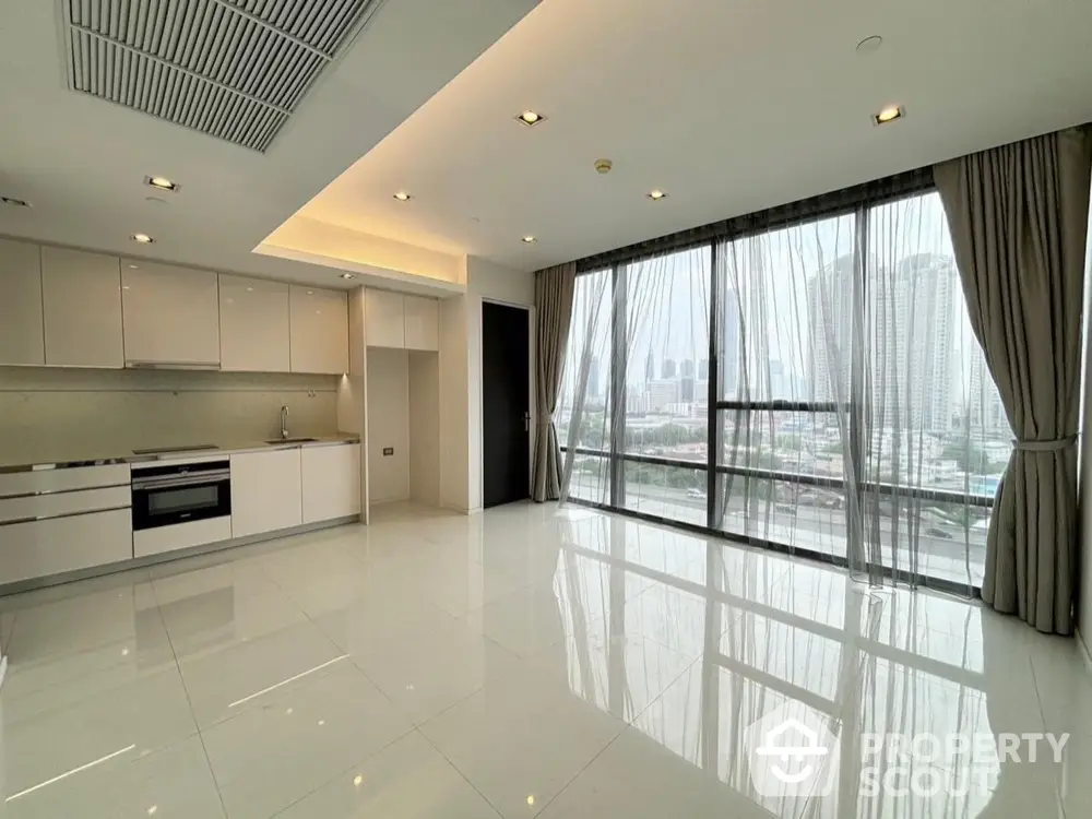 Spacious modern kitchen with city view and open layout in luxury apartment