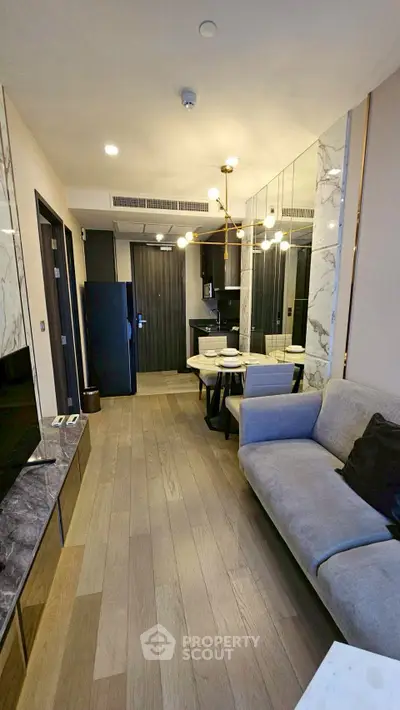 Modern living room with elegant decor and open layout in a stylish apartment.