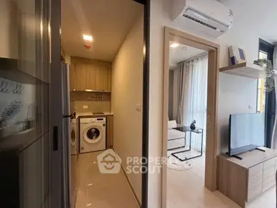 Modern apartment interior with laundry area and cozy living room