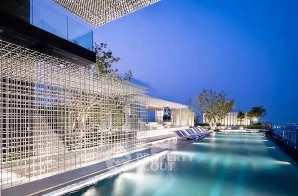 Luxurious rooftop pool with stunning city views and modern architectural design.