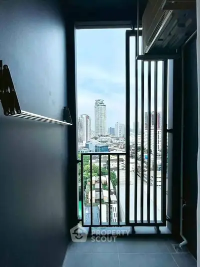 Stunning urban view from a high-rise balcony with sleek modern design.