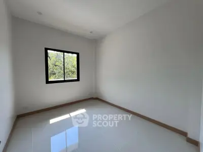 Bright empty room with large window and glossy tiled floor, perfect for customization.