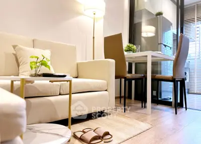 Stylish modern living room with cozy seating and elegant dining area, perfect for urban living.