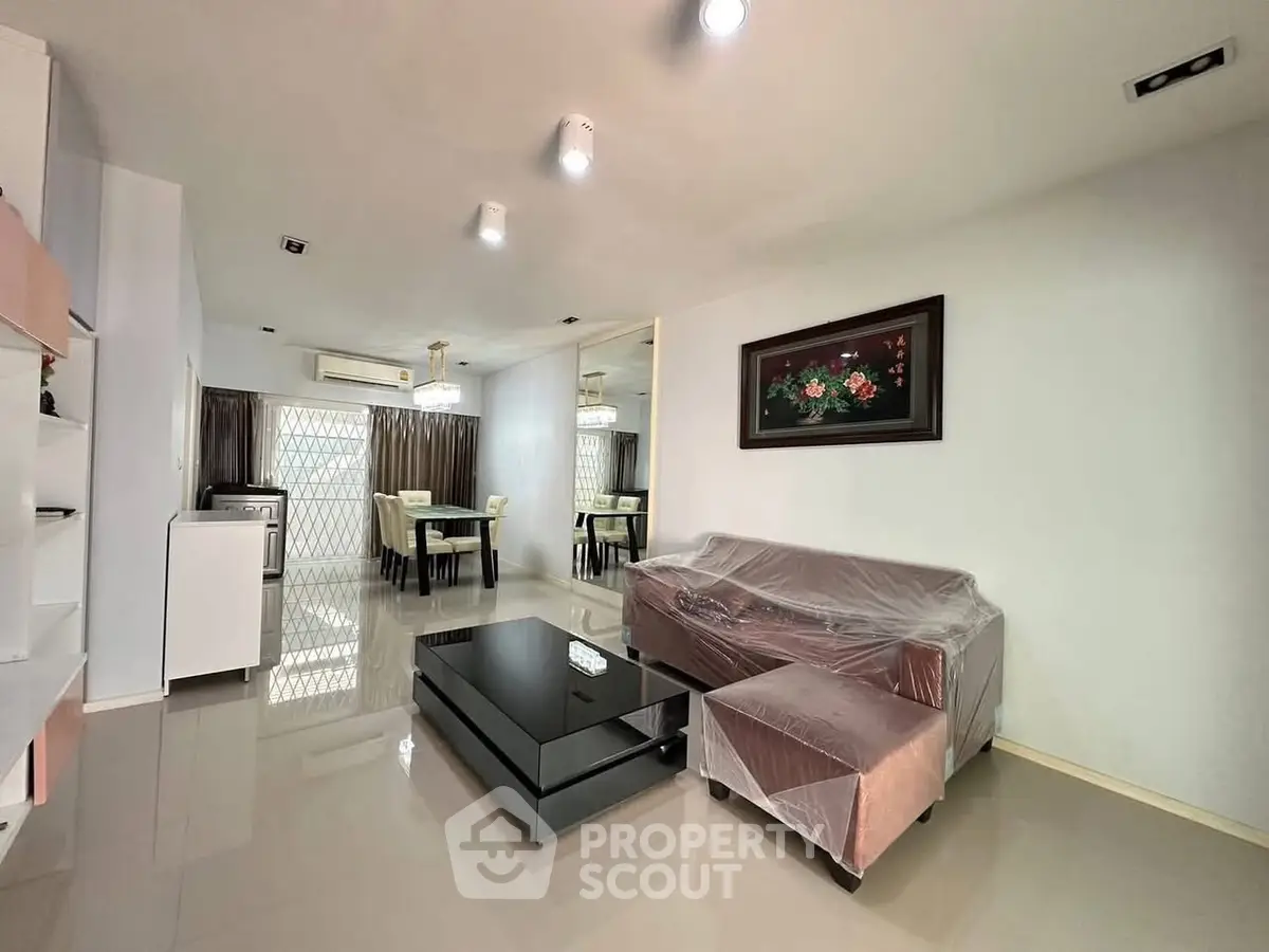 Spacious living room with modern furniture and elegant dining area