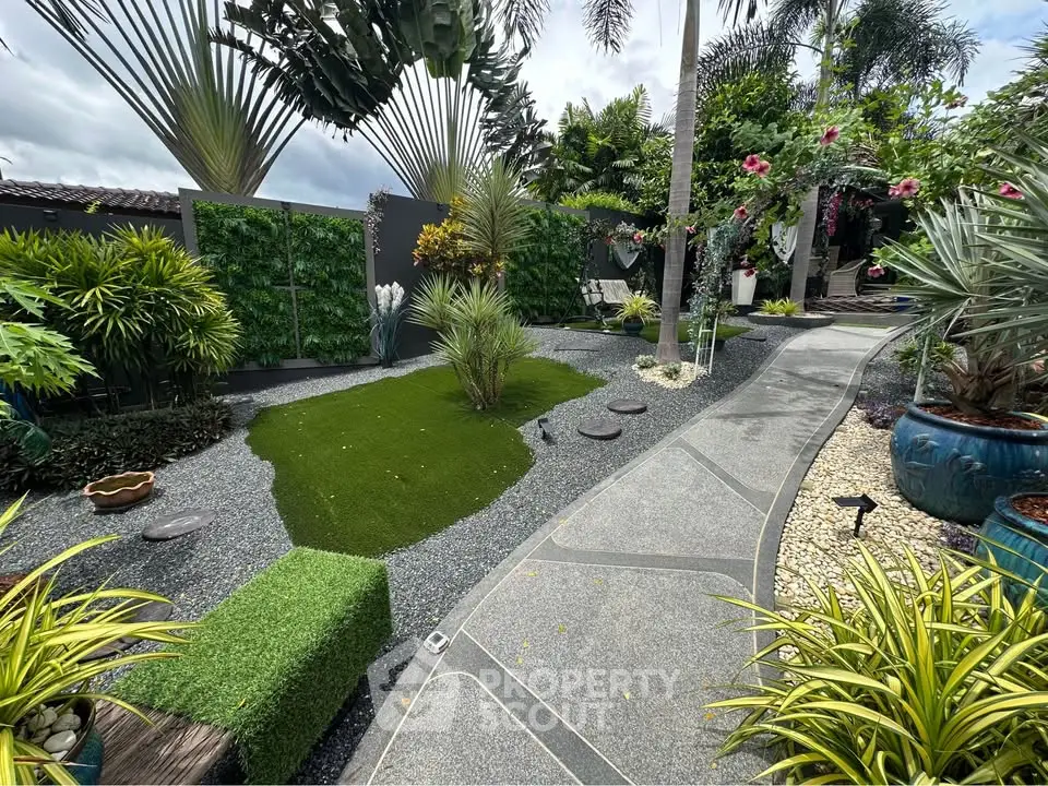 Lush tropical garden with modern landscaping and vibrant greenery