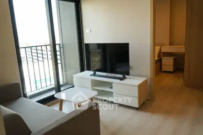 Modern living room with balcony access and sleek furniture