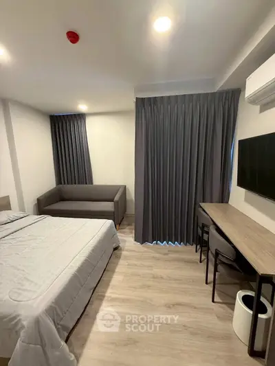 Modern bedroom with sleek furniture and cozy ambiance