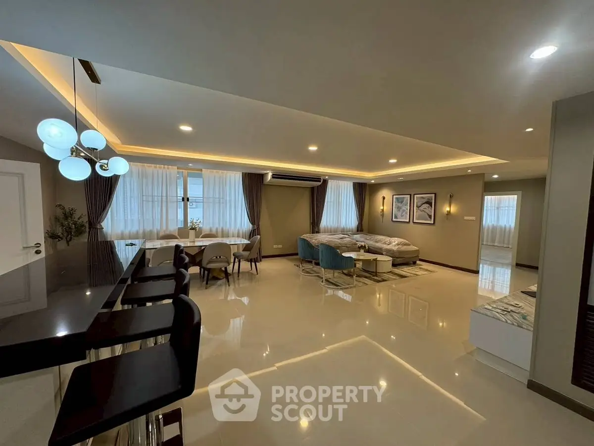 Spacious modern living room with elegant lighting and stylish furniture