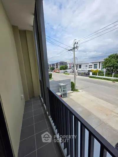 Spacious balcony with street view in modern residential area