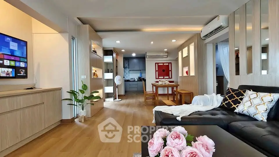 Spacious modern living room with open kitchen and stylish decor