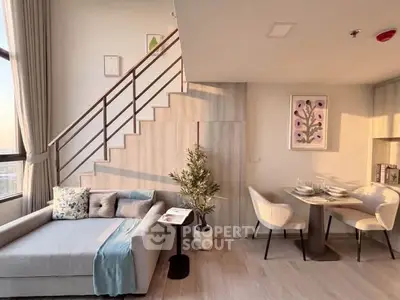 Modern duplex living room with stylish decor and dining area