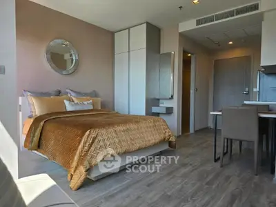 Modern bedroom with stylish decor and cozy atmosphere in a contemporary apartment.