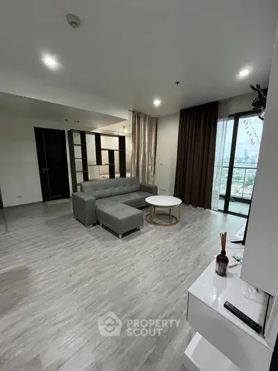 Spacious modern living room with city view and stylish decor