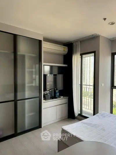 Modern bedroom with balcony view in high-rise apartment