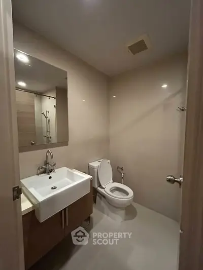Modern bathroom with sleek fixtures and neutral tones