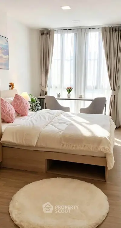 Bright and cozy bedroom with large windows and stylish decor