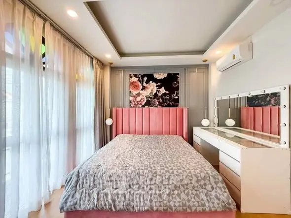 Chic bedroom with floral accent wall and modern decor