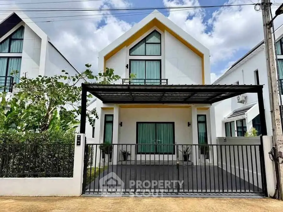 Modern two-story house with sleek design and spacious driveway