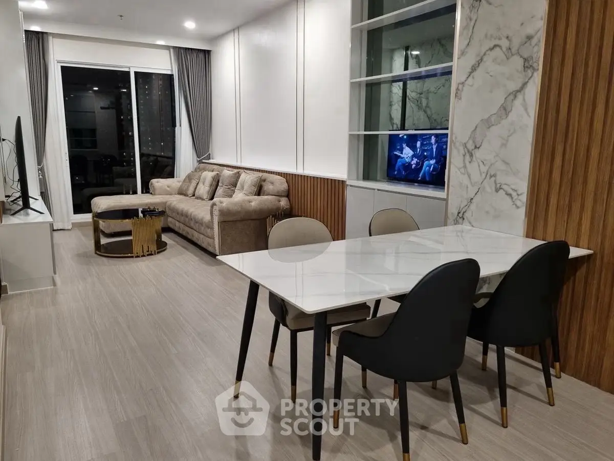 Modern living room with elegant dining area and stylish furniture in a contemporary apartment.