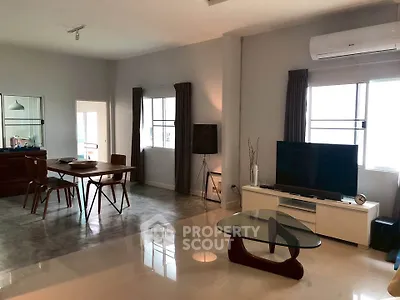 Spacious modern living room with dining area and stylish furniture