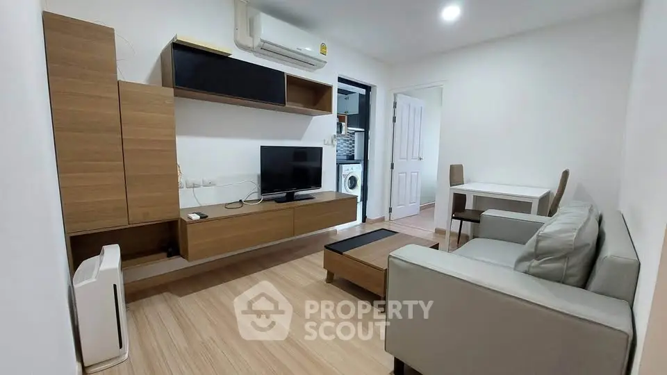 Modern living room with sleek furniture and integrated storage solutions