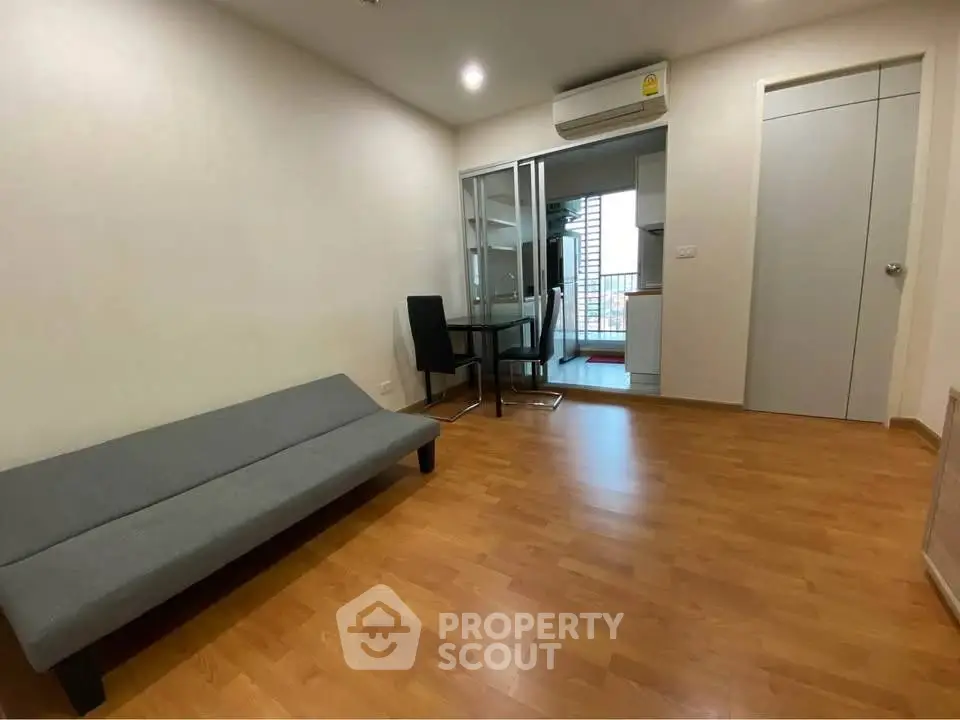 Modern living room with wooden flooring and minimalist furniture