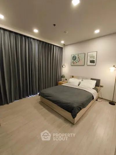 Modern bedroom with elegant decor and cozy lighting